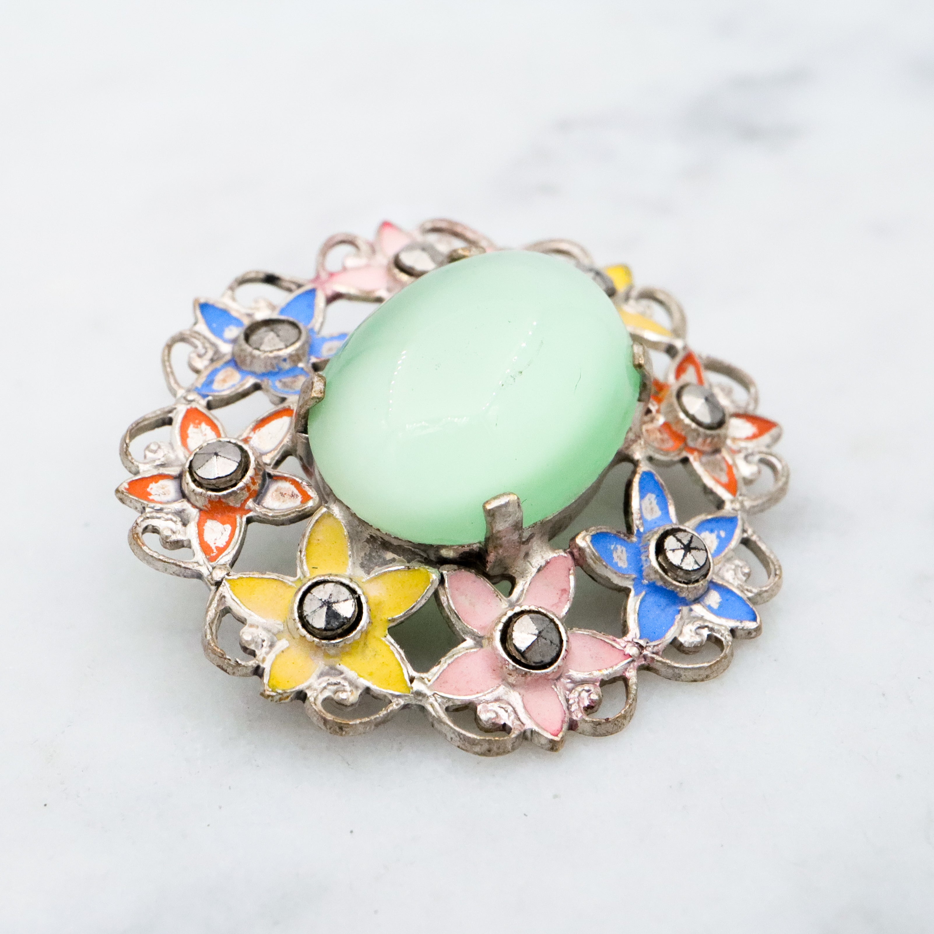 Antique Art Deco green cats eye enamel flower brooch